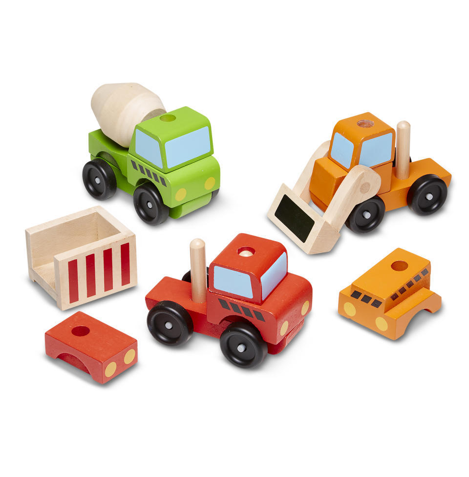 This photo released by Melissa & Doug shows stacking toy wood vehicles. Chances are good you know at least one parent who sings the praises of wooden toys for their durability, sustainability or magical powers to boost creativity. (Melissa & Doug via AP)