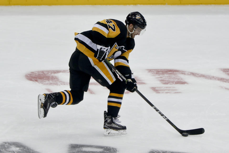 FILE - Pittsburgh Penguins' Adam Johnson plays against the Columbus Blue Jackets during an NHL preseason hockey game, Saturday, Sept. 22, 2018, in Pittsburgh. The death of American hockey player Adam Johnson from a cut to the neck in England has reignited the debate over skate blade safety. (AP Photo/Keith Srakocic, File)
