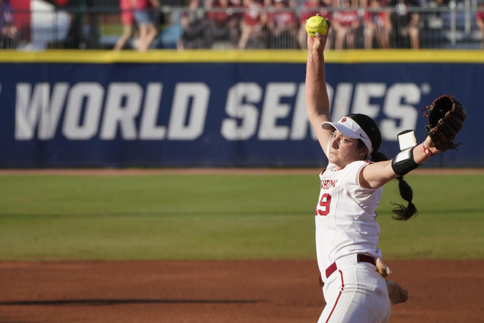 Oklahoma's Nicole May pitches in the first inning against Florida State during the first game of the NCAA Women's College World Series softball championship series Tuesday, June 8, 2021, in Oklahoma City. (AP Photo/Sue Ogrocki)