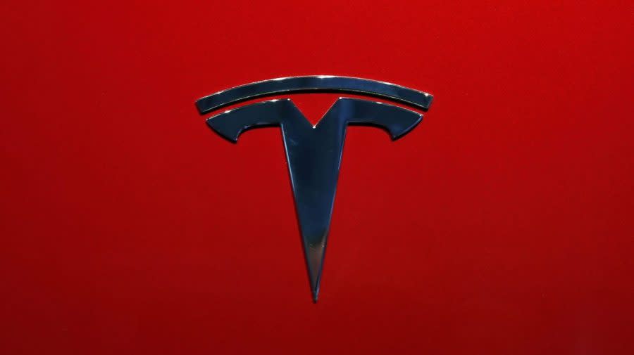 <em>The logo of Tesla model 3 is seen at the Auto show on Oct. 3, 2018, in Paris. (AP Photo/Christophe Ena)</em>