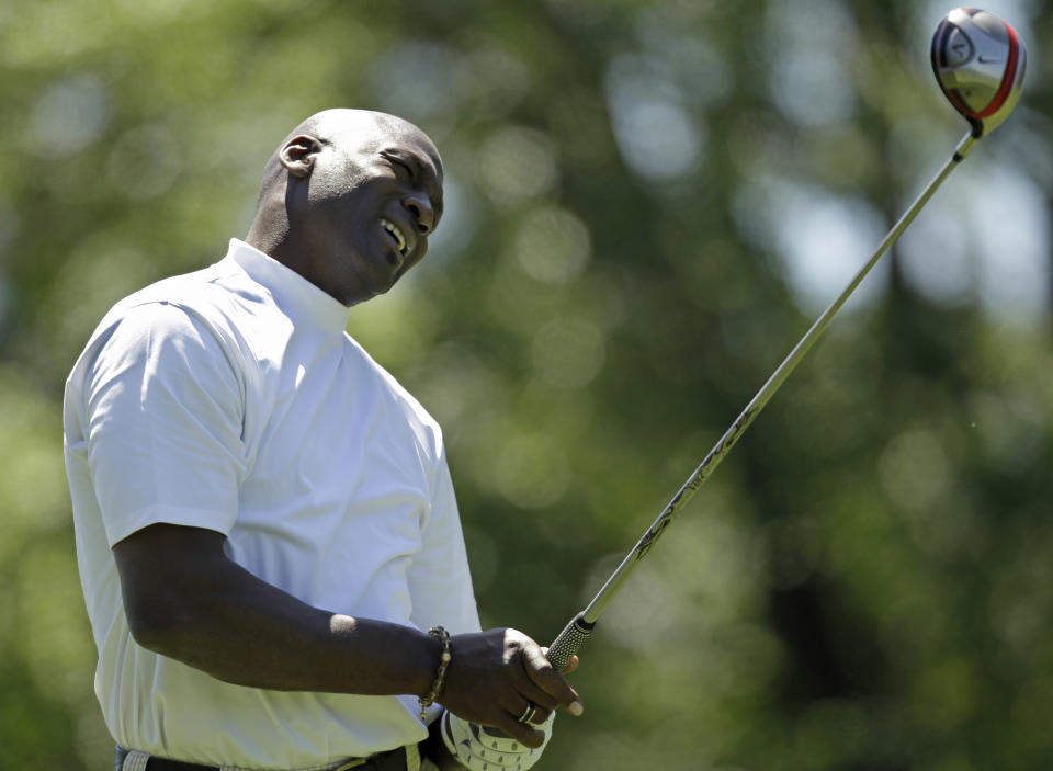 Michael Jordan watches his tee shot on the ninth hole during the pro-am dor the Quail Hollow Championship golf tournament at Quail Hollow Club in Charlotte, N.C., Wednesday, April 28, 2010. (AP Photo/Chuck Burton)