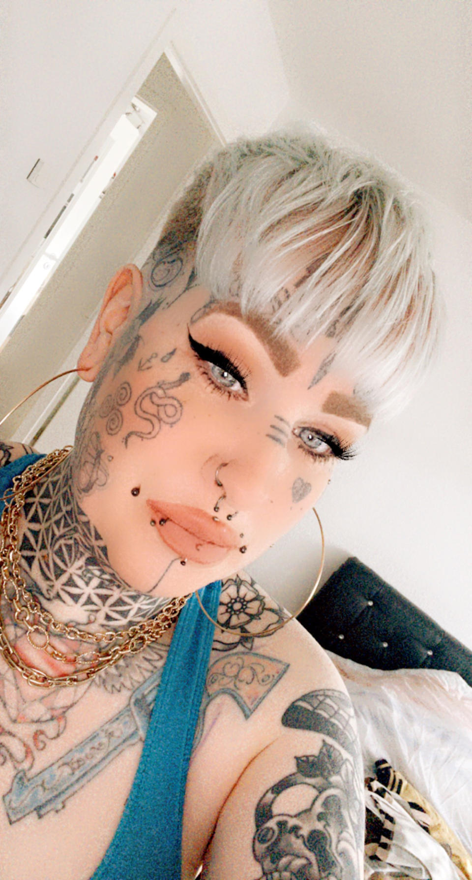 Sabrina showing off her face tattoos (Collect/PA Real Life)