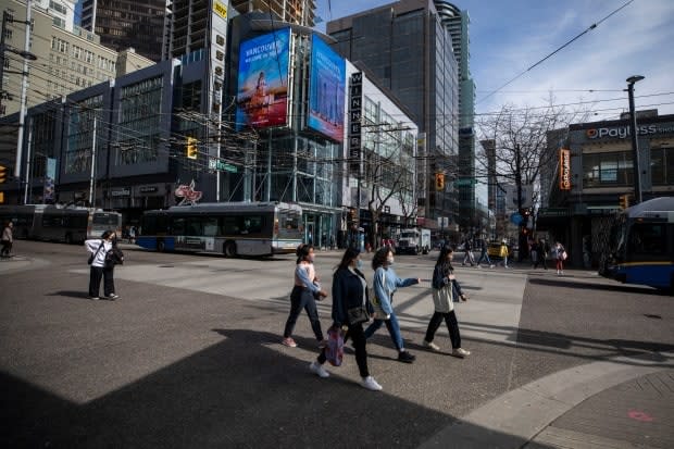 People are pictured in downtown Vancouver on April 6. B.C. is set to move ahead to Step 2 of its reopening plan on Tuesday as case counts and hospitalizations decline and vaccination rates rise. (Ben Nelms/CBC - image credit)