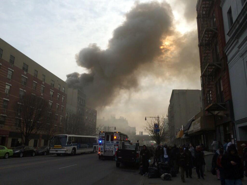 In this photo provided by Shane Kennedy, smoke rises from the site of an explosion and building collapse near Park Avenue and 116th Street in the East Harlem neighborhood of New York, Wednesday, March 12, 2014. (AP Photo/Shane Kennedy)