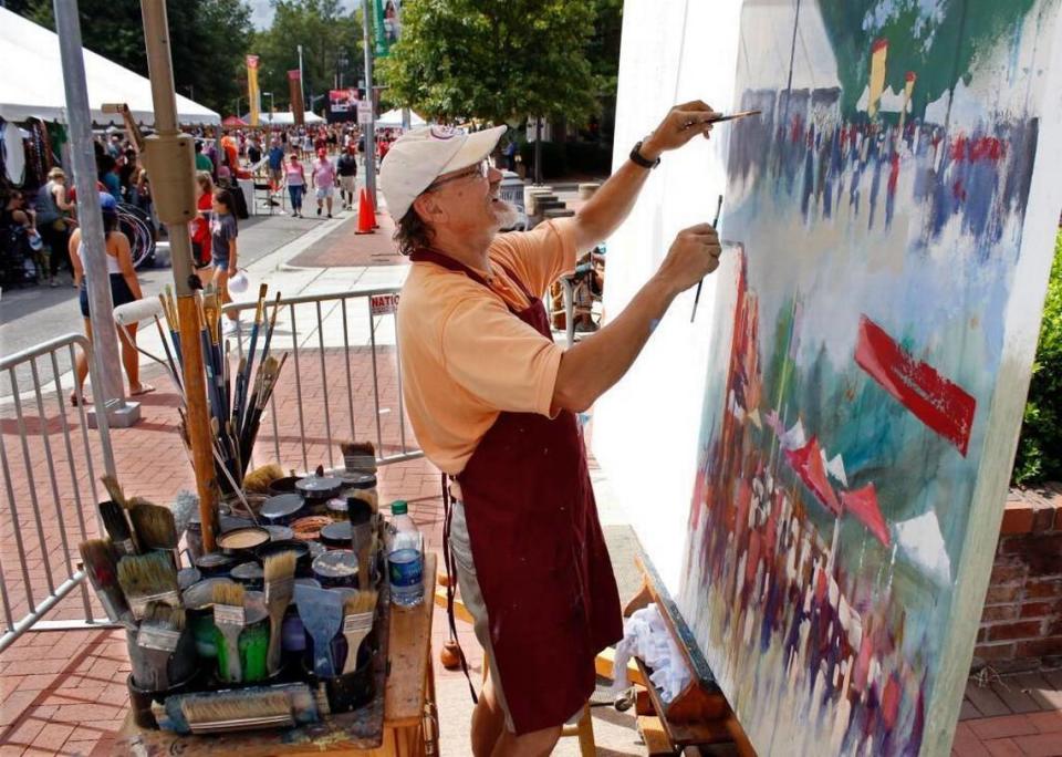 Raleigh artist Dan Nelson seemed to enjoy making his abstract color mural of the passing street scene at Hillsborough and Pogue Streets.