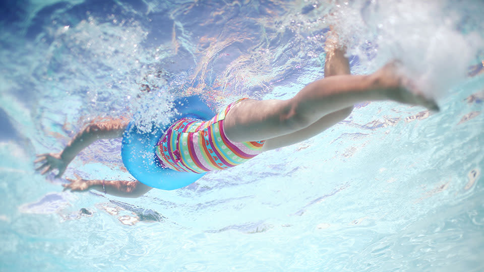 Kid swimming in pool