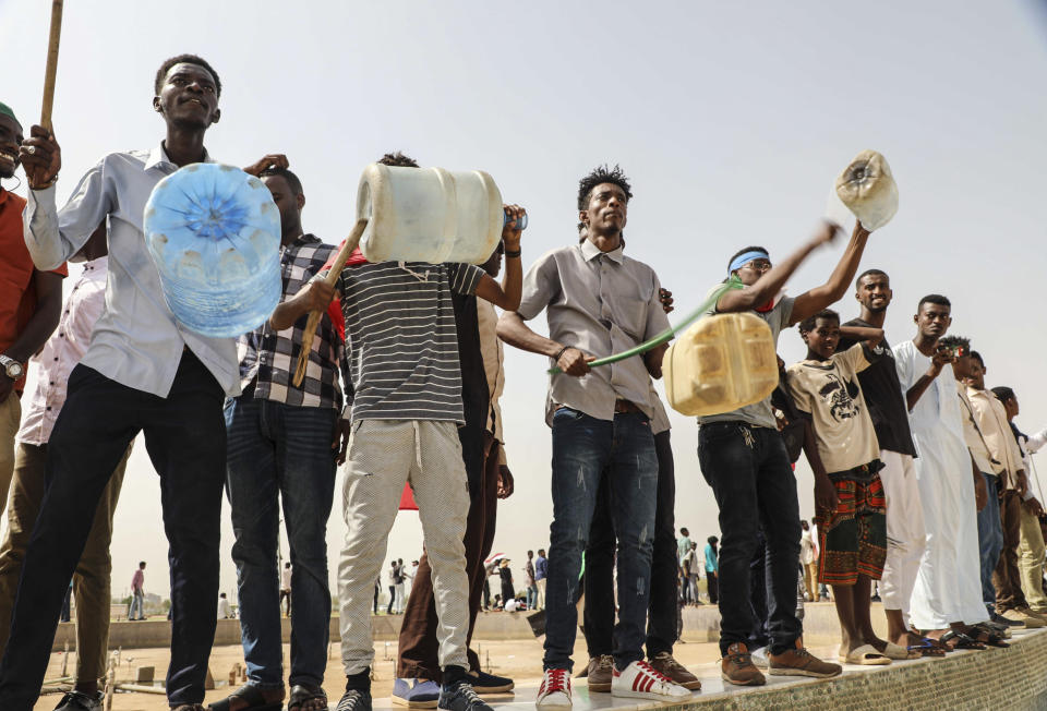 People take part in a protest condemning a deadly crackdown last month in Khartoum, Sudan, Thursday, July 18, 2019. Thousands of Sudanese have joined protests as tensions remain high despite recent progress toward a power-sharing deal with the ruling military council. (AP Photo/Mahmoud Hjaj)