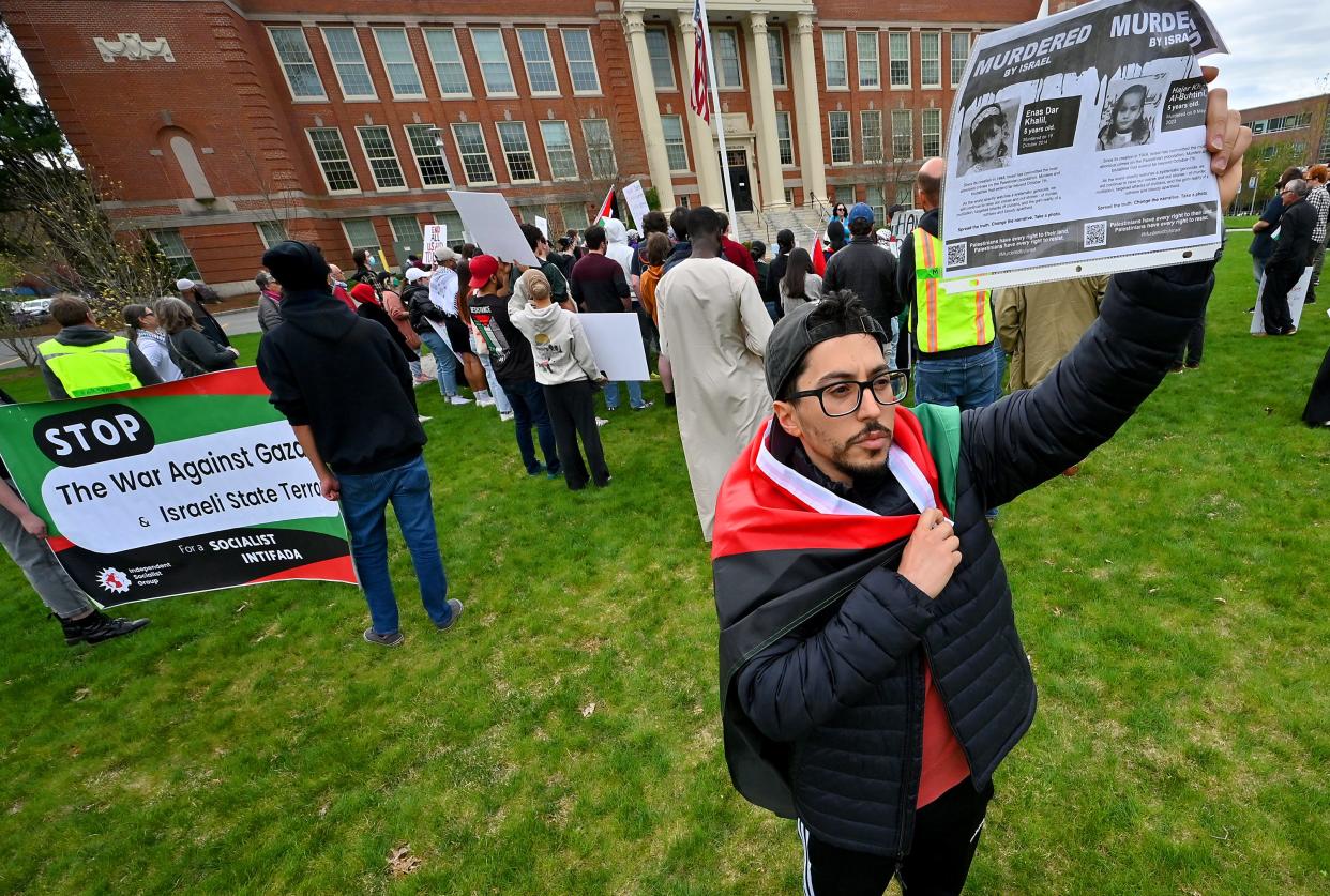 Mohamed Mohamed, of Worcester, faces towards Chandler Street during the rally.