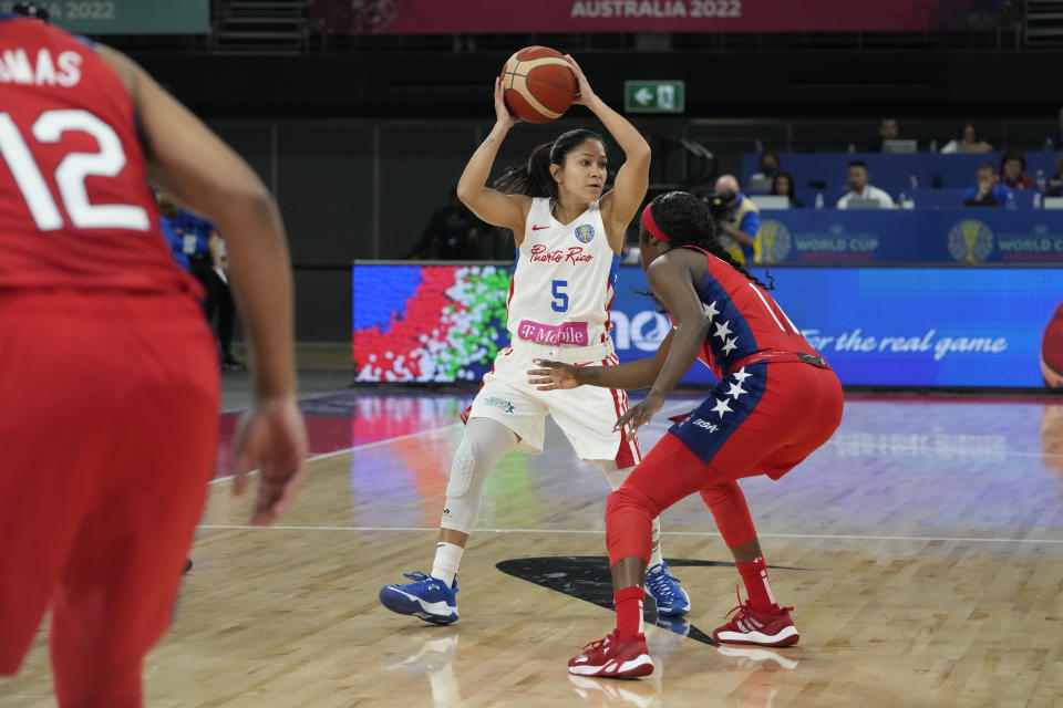 Puerto Rico's Pamela Rosado tries to get the ball past United States' Kahleah Copper at the women's Basketball World Cup in Sydney, Australia, Friday, Sept. 23, 2022. (AP Photo/Mark Baker)