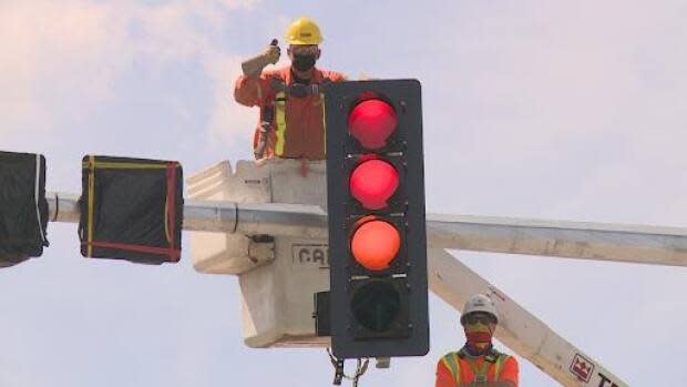 The new lights at the main intersection in Bragg Creek will be operational by the Victoria Day weekend. (Helen Pike/CBC - image credit)