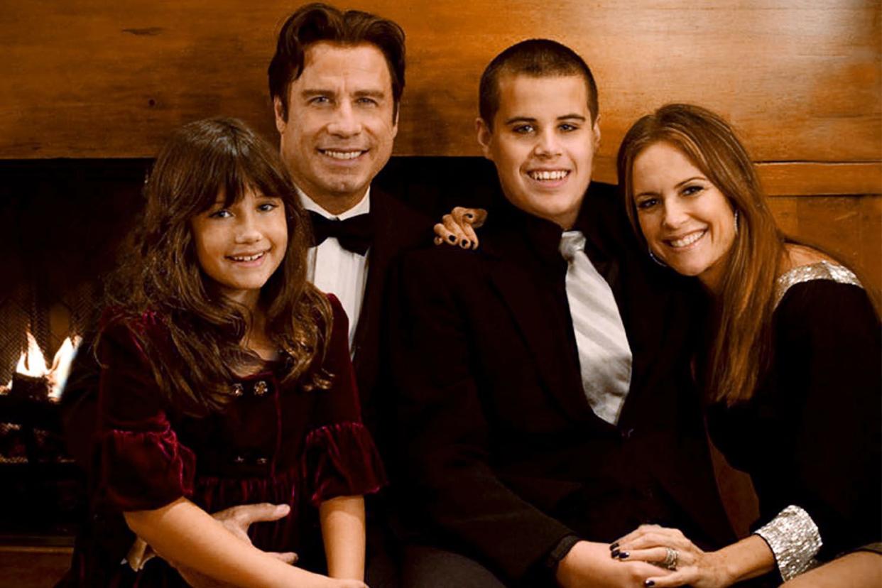 John Travolta (2nd L), his wife Kelly Preston (R) and their children Jett (2nd R) and Ella