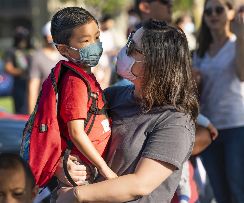 Tustin, CA - August 11: A student talks with his mom before his first day of kindergarten at Tustin Ranch Elementary School in Tustin, CA on Wednesday, August 11, 2021. (Photo by Paul Bersebach/MediaNews Group/Orange County Register via Getty Images)