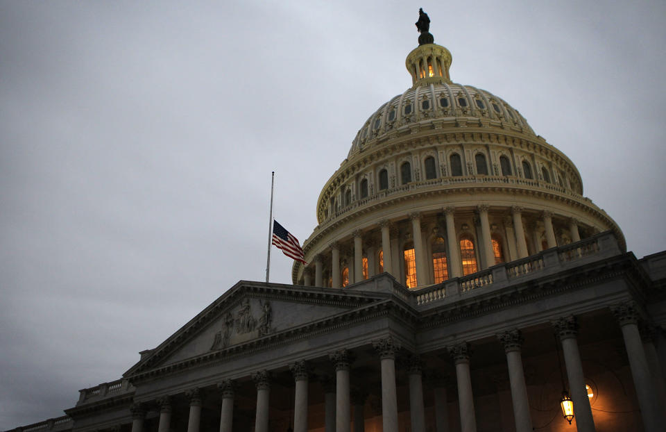 A U.S. flag flies at half staff on the U.S. Capitol April 15, 2013 on Capitol Hill in Washington, D.C. (Photo by Alex Wong/Getty Images)