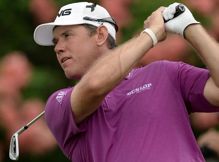 Lee Westwood tees off on the 11th hole during the final round of the Malaysian Open golf tournament in Kuala Lumpur on April 20, 2014