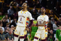Arizona State's Luther Muhammad (1) and Devan Cambridge (35) celebrate after Muhammad's 3-point basket against Oregon during the first half of an NCAA college basketball game, Saturday, Feb. 4, 2023, in Tempe, Ariz. (AP Photo/Darryl Webb)