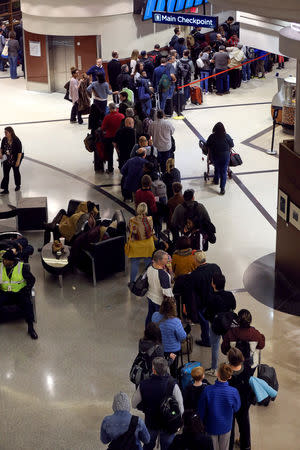 A line of passengers waiting to pass through the main Transportation Security Administration (TSA) security checkpoint is seen at Hartsfield-Jackson Atlanta International Airport amid the partial federal government shutdown, in Atlanta, Georgia, U.S., January 18, 2019. REUTERS/Elijah Nouvelage