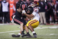 Southern California defensive lineman Tuli Tuipulotu (49) sacks Utah quarterback Jake Bentley (8) in the second half during an NCAA college football game Saturday, Nov. 21, 2020, in Salt Lake City. (AP Photo/Rick Bowmer)