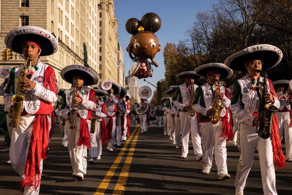 A Mexican marching band leads the Ada Twist, Scientist balloon. (Yuki Iwamura / AFP - Getty Images)