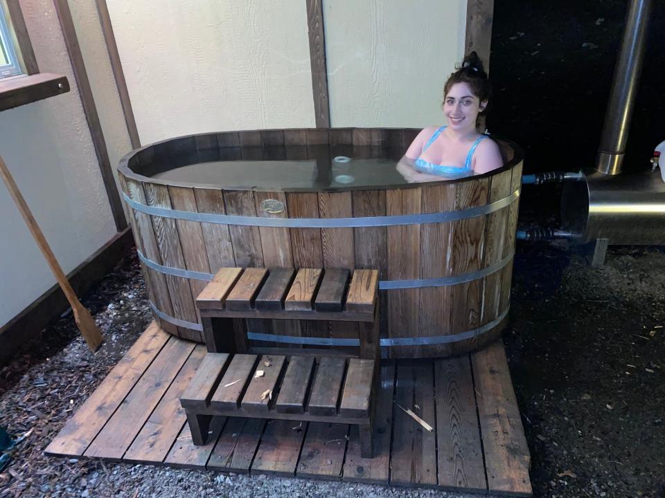 Paige DiFiore in wood-fired hot tub