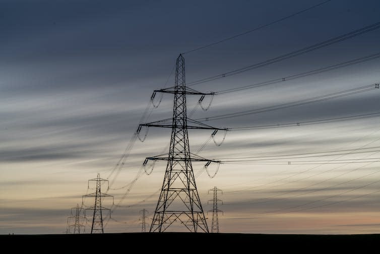 Pylons against night sky