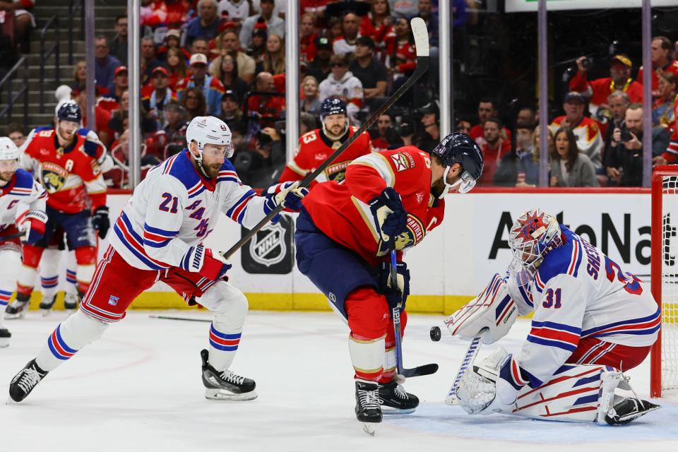 May 26, 2024; Sunrise, Florida, USA; Florida Panthers center Aleksander Barkov (16) shoots the puck against New York Rangers goaltender Igor Shesterkin (31) during the first period in game three of the Eastern Conference Final of the 2024 Stanley Cup Playoffs at Amerant Bank Arena.