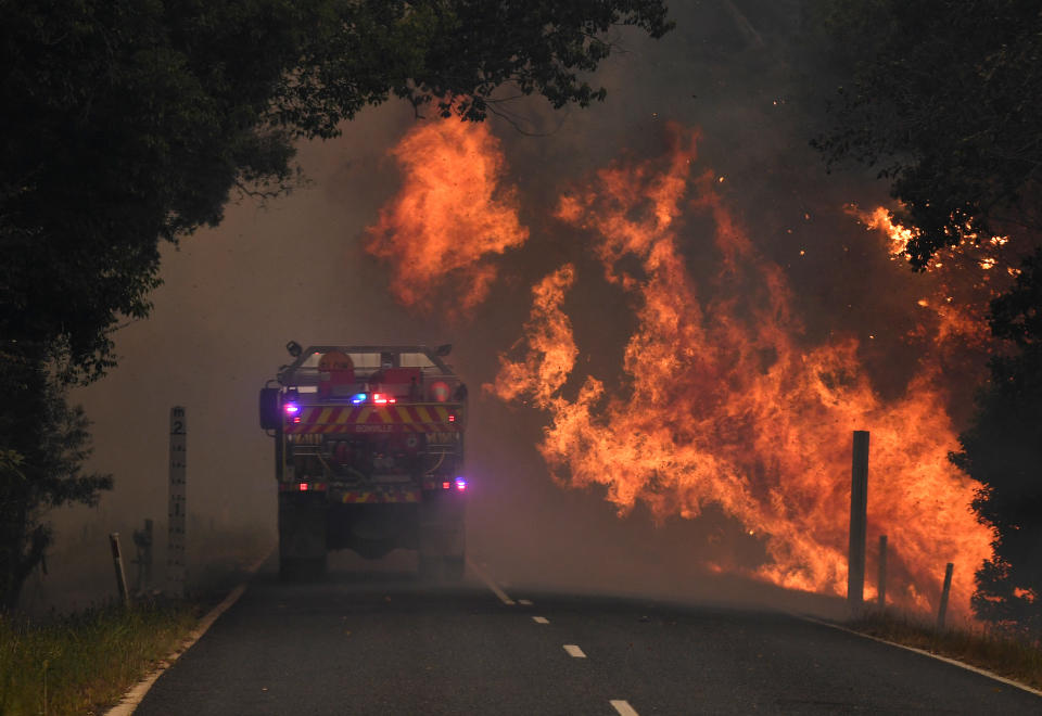 A fire truck is seen near a bushfire in Nana Glen, near Coffs Harbour.