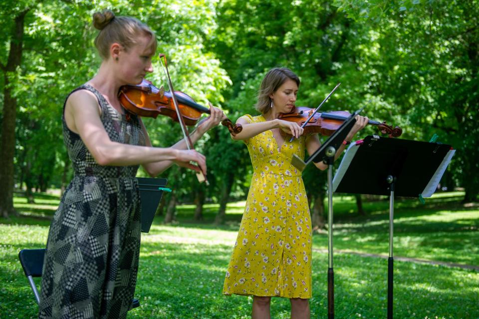 Violinists Audrey Price and Rachel Loseke during the Music at the Market concert in Walter Hardy Park on Sunday, June 5, 2022. Performed by Knoxville Symphony Orchestra musicians, the concert was held to raise funds for the Austin-East Foundation. 