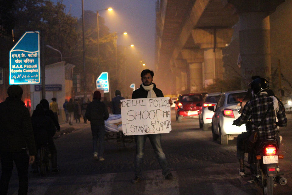 Students and local residents hold placards and raise slogans as they take part in a protest against the Citizenship Amandment Act (CAA) and National Register of Citizens (NRC), at Jamia Millia Islamia University, on December 19, 2019 in New Delhi, India. (Photo by Mayank Makhija/NurPhoto via Getty Images)