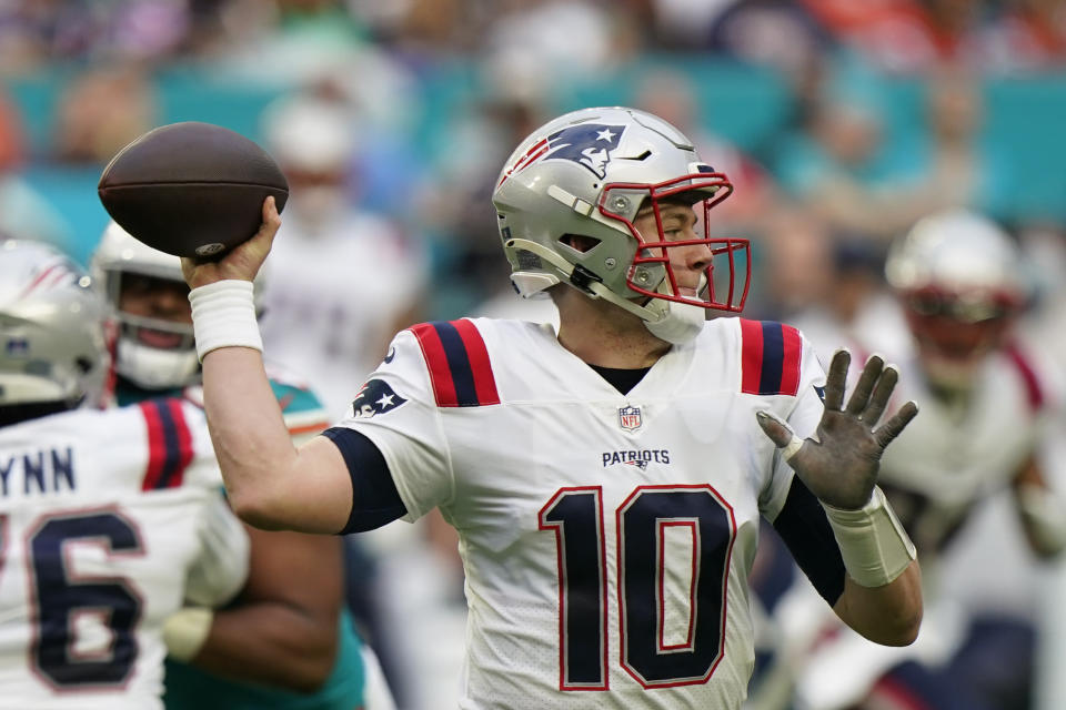 New England Patriots quarterback Mac Jones (10) looks to pass during the first half of an NFL football game against the Miami Dolphins, Sunday, Jan. 9, 2022, in Miami Gardens, Fla. (AP Photo/Willfredo Lee)