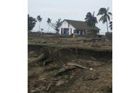 This image made from video provided by Broadcom Broadcasting shows a damaged Mormon church on the Tongan island of Atata, Sunday, Jan. 16, 2022, the day after tsunami caused by a volcanic eruption near Tonga. (Kilo Folau/Broadcom Broadcasting via AP)