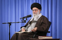 In this picture released by an official website of the office of the Iranian supreme leader, Supreme Leader Ayatollah Ali Khamenei talks to clerics in his Islamic thoughts class in Tehran, Iran, Sunday, Nov. 17, 2019. Iran's supreme leader on Sunday backed the government's decision to raise gasoline prices and called angry protesters who have been setting fire to public property over the hike "thugs," signaling a potential crackdown on the demonstrations. (Office of the Iranian Supreme Leader via AP)