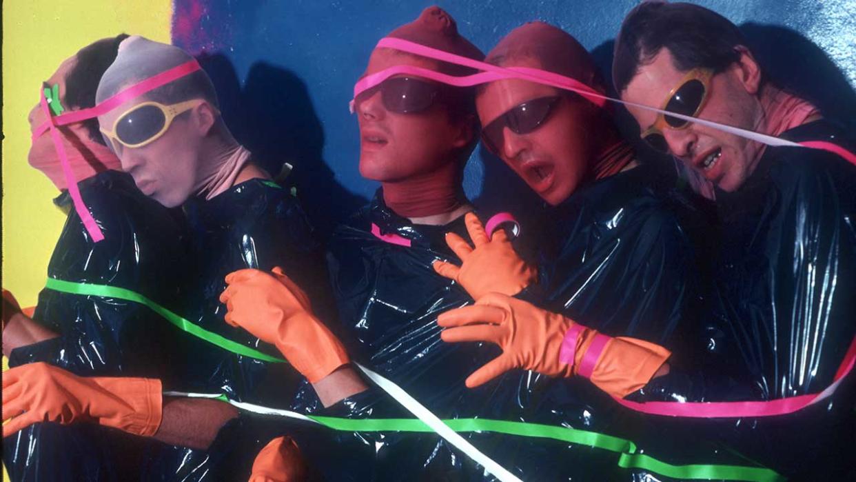  Bob Mothersbaugh, Mark Mothersbaugh, Alan Myers, Gerald Casale and Bob Casale of the punk new wave music group "Devo" pose for a portrait covered in tape and nylon material in circa 1980 