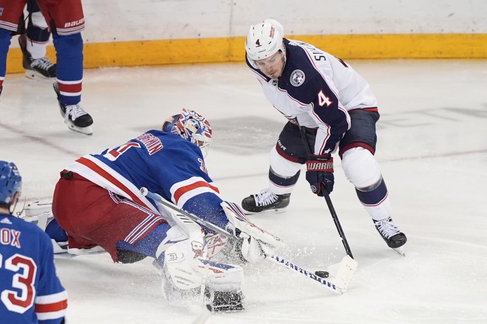 Columbus Blue Jackets' Cole Sillinger (4) shoots against New York Rangers goaltender Igor Shesterkin (31) during the third period of an NHL hockey game Wednesday, Feb. 28, 2024, in New York. (AP Photo/Frank Franklin II)