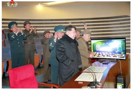 North Korean leader Kim Jong Un reacts as he watches a long range rocket launch in this still image taken from KRT footage and released by Yonhap on February 7, 2016. REUTERS/Yonhap