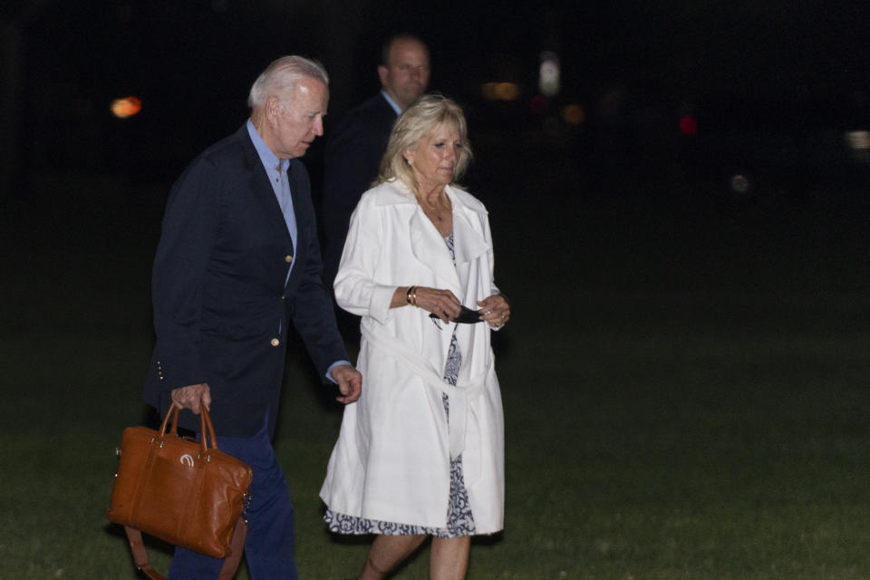 President Joe Biden and first lady Jill Biden walk on the Ellipse near the White House in Washington, as they arrive from a weekend trip to their house in Wilmington, Del., late Sunday, June 20, 2021. (AP Photo/Manuel Balce Ceneta)