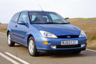<p>Its status as a family favourite meant that Ford’s decision to kill off the Escort shocked many. Its replacement, the Focus Mk1, was a key player in Ford’s <strong>‘New Edge’</strong> design revolution for the new millenium. The hatchback version had revolutionary styling with wheel arches that are scored into the body work.</p><p>The rear is the most progressive element, with prominent lights that are integrated into the pillars. Even though we’re now used to seeing cars with really distinctive aesthetics, when you see a Focus M1k it’s impossible not to take a second look—for all the right reasons.</p>