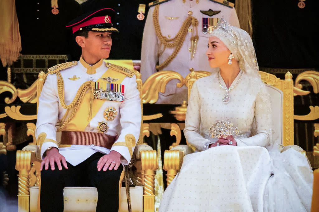 topshot prince abdul mateen l and yang mulia anisha rosnah sit during their wedding reception at istana nurul iman in bruneis capital bandar seri begawan on january 14, 2024 lavish celebrations for the wedding of bruneis prince abdul mateen and his wife reached a climax on january 14 with a glittering ceremony attended by government leaders and blue blooded guests from asia and the middle east photo by iqbal dato hj selamat afp photo by iqbal dato hj selamatafp via getty images