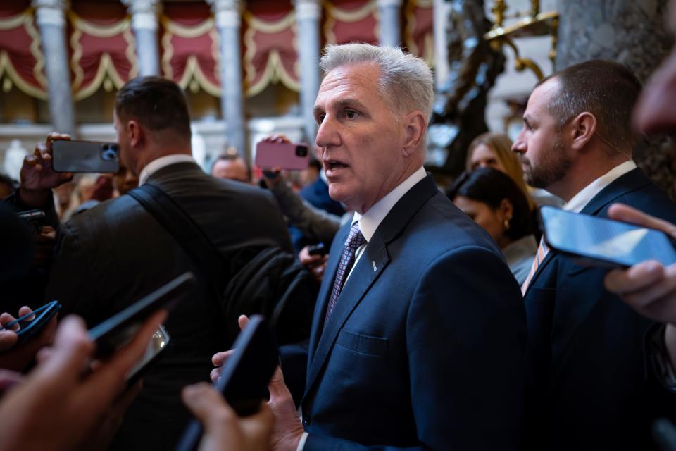 Speaker of the House Kevin McCarthy, R-Calif., stops for reporters' questions about passing a funding bill and avoiding a government shutdown, at the Capitol in Washington, Monday, Sept. 18, 2023. McCarthy is trying to win support from right-wing Republicans by including spending cuts and conservative proposals for border security and immigration.