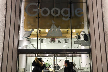 Pedestrians walk past Google headquarters in the Manhattan borough of New York City, New York, U.S., December 17, 2018. REUTERS/Jeenah Moon