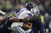 FILE PHOTO: Dec 24, 2017; Arlington, TX, USA; Dallas Cowboys quarterback Dak Prescott (4) is hit in the helmet by the Seattle Seahawks free safety Earl Thomas (29) at AT&T Stadium. Erich Schlegel-USA TODAY Sports
