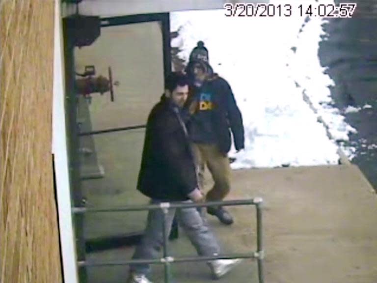 Boston bomber Dzhokhar Tsarnaev(R) and his brother Tamerlan leave a New Hampshire firing range less than a month before the Boston Marathon bombings