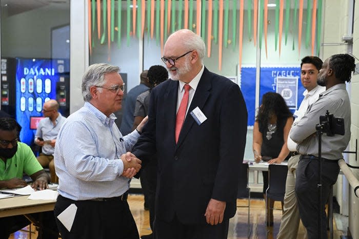 Nashville Mayor John Cooper shakes Metro Community Development Manager Fabian Bedne's hand at a voting expo during the 2021 Bordeaux North Nashville Participatory Budgeting Process.