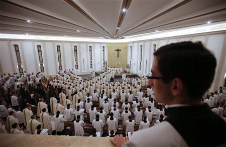 Priests enter in procession for a mass led by Father Eduardo Robles Gil, the new leader of the Legionaries of Christ order, in the order seminary in Rome February 6, 2014. REUTERS/Max Rossi