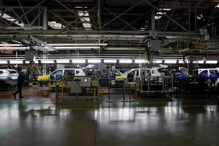 Employees work on Baojun RS-5 cars at a final assembly plant operated by General Motors Co and its local joint-venture partners in Liuzhou, Guangxi Zhuang Autonomous Region, China, February 28, 2019. REUTERS/Aly Song