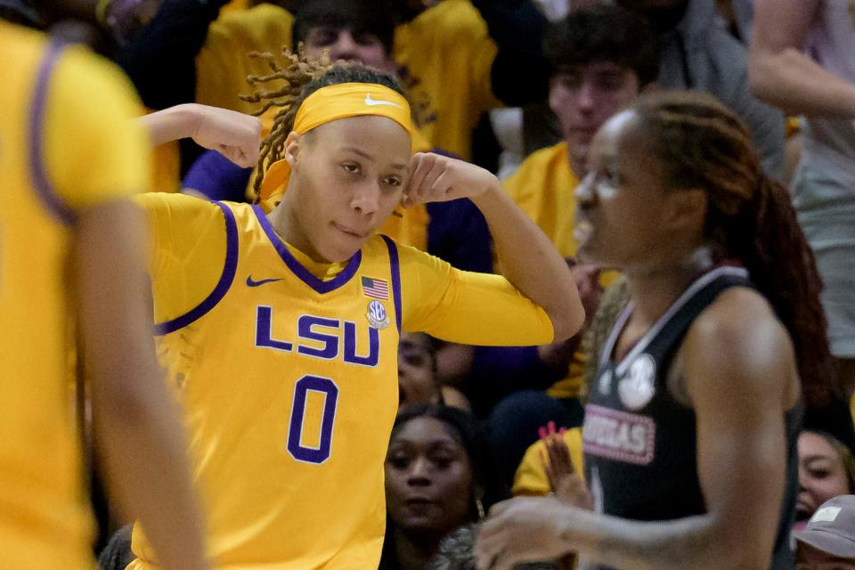 LSU forward LaDazhia Williams (0) flexes after making a basket and getting an additional free throw against Mississippi State in the first half of an NCAA college basketball game Sunday, Feb. 26, 2023, in Baton Rouge, La. (AP Photo/Matthew Hinton)