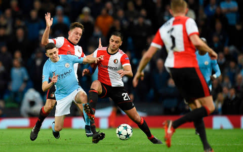 Phil Foden battles for the ball - Credit: AFP