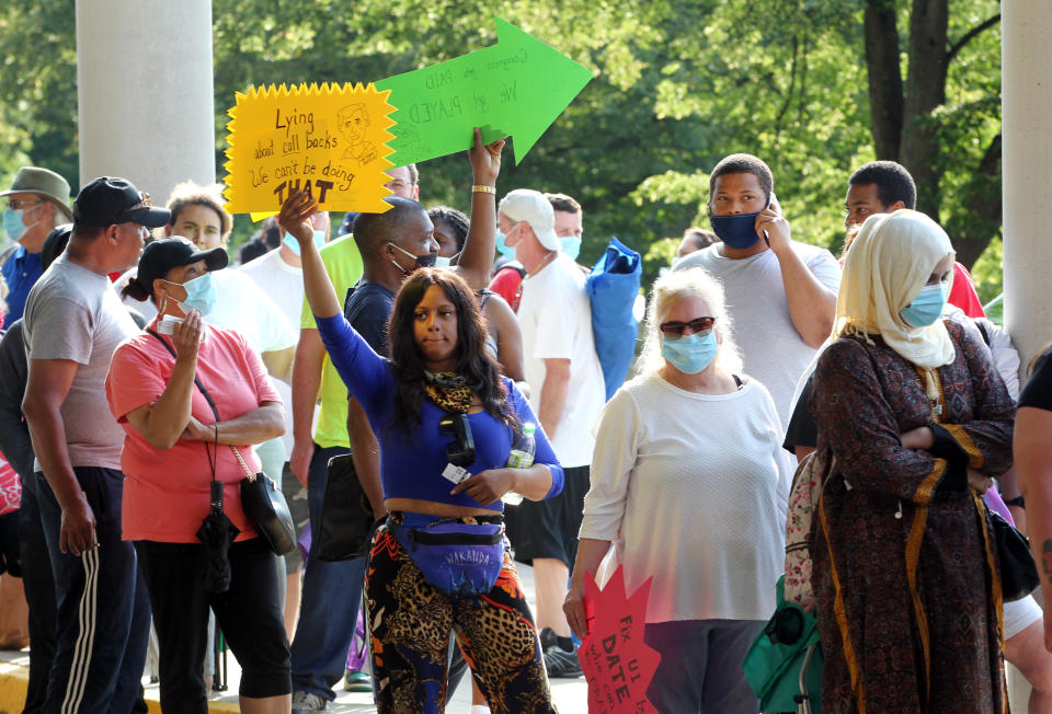 FRANKFORT, KY - JUNE 19: Hundreds of unemployed Kentucky residents wait in long lines outside the Kentucky Career Center for help with their unemployment claims on June 19, 2020 in Frankfort, Kentucky. (Photo by John Sommers II/Getty Images)