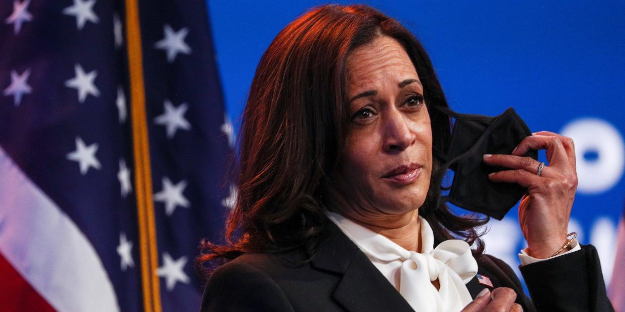 Vice President-elect Kamala Harris listens as U.S. President-elect Joe Biden speaks to reporters following their online meeting with members of the National Governors Association (NGA) executive committee in Wilmington, Delaware, on November 19, 2020.