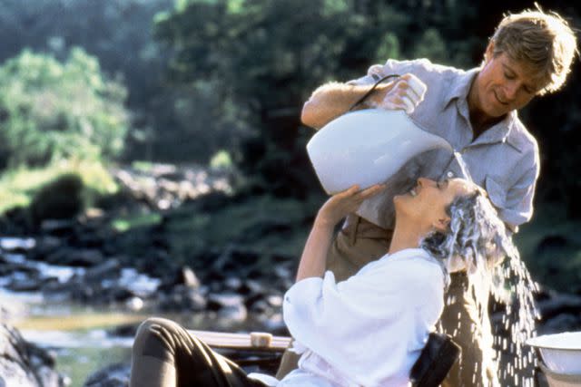 <p>Sunset Boulevard/Corbis via Getty</p> Meryl Streep and Robert Redford in <i>Out of Africa</i>, 1985