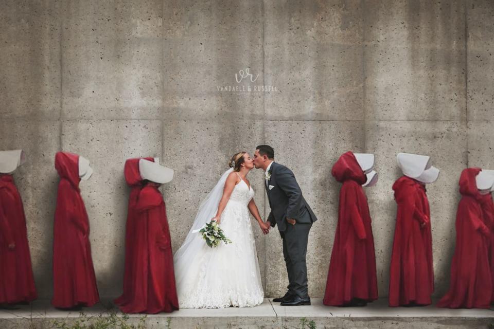 A wedding portrait shot at the location for Gilead's gruesome Wall - with women in red robes digitally added - has sparked controversy. Photo: Courtesy of Van Daele & Russell.